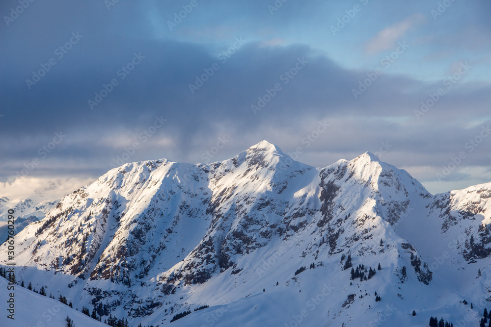 Mountain portrait Birnhorn Saalbach dramatic clouds perfect blue sky light scenic mood