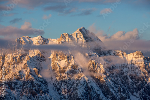 Fototapeta Naklejka Na Ścianę i Meble -  Mountain portrait Birnhorn Saalbach sunset clouds perfect blue sky light