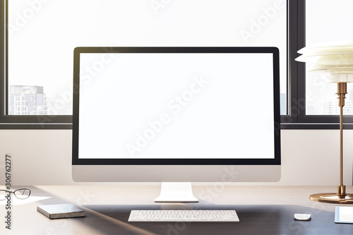 Desktop with empty white computer screen