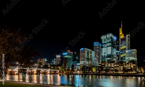 frankfurt skyline at night with colorful reflections in the main river  frankfurt am main  germany