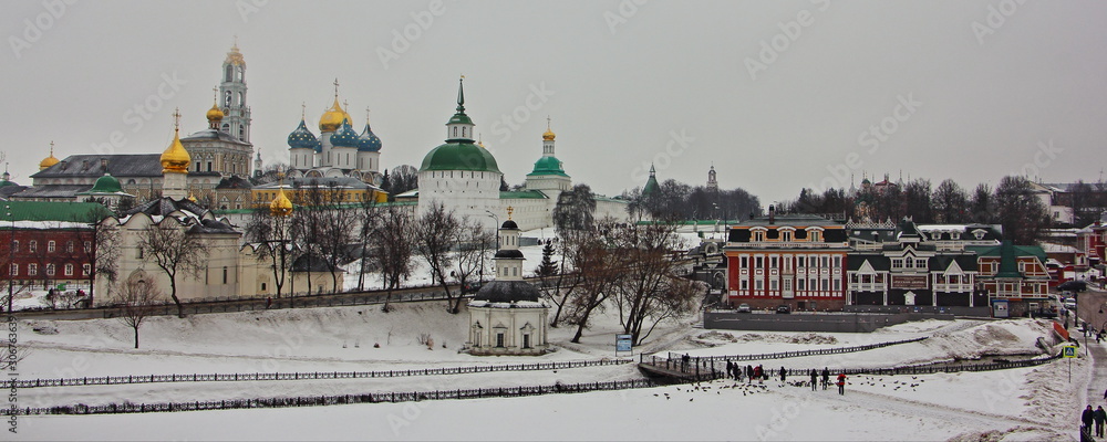 Sergiev Posad, Moscow Region,  Troitse Sergieva lavra monastery panorama, Russian Golden Ring landmark on snowy winter day, view from observation deck on gray sky background
