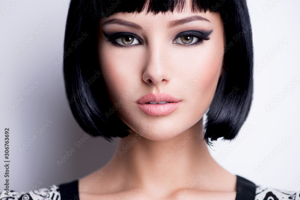 Fototapeta premium Beautiful brunette woman with short hairstyle.