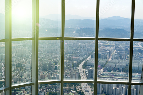 View at Seoul, South Korea from high floor at viewpoint at sunny day through huge windows