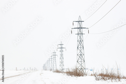 Line of Electrical Transmission Towers in Winter © Steve