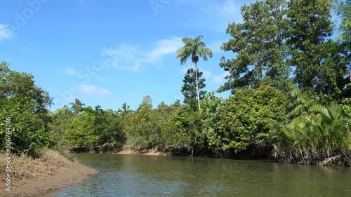 Boating on a small river in San Vicente with banga boat, Palawan, Philipinnes photo