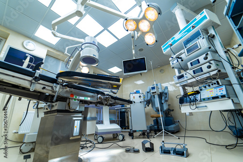 Medical devices and industrial lamps in surgery room of modern hospital. Interior hospital design concept © Vadim