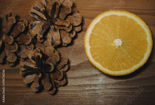Fototapeta Naklejka Na Ścianę i Meble -   half an orange on a wooden table