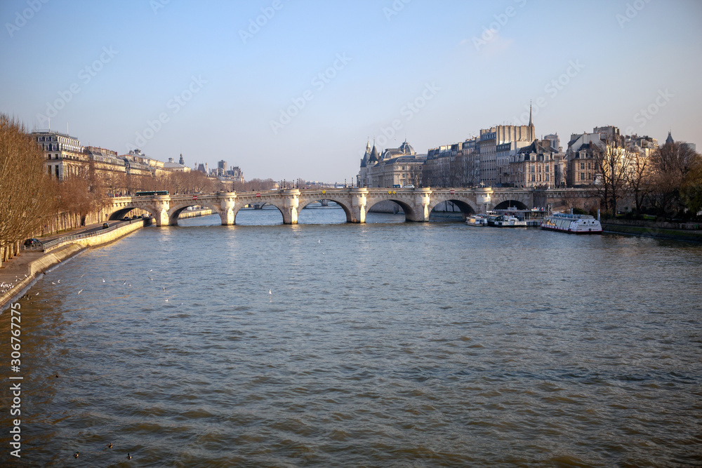 View of a historical bridge called Pont Neuf on Seine river in Paris.