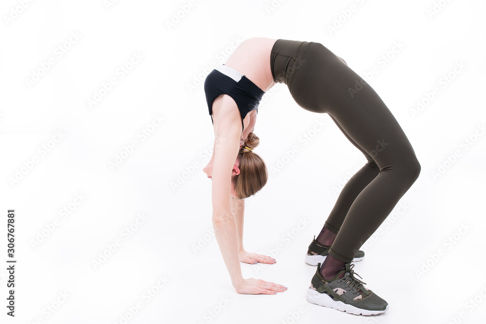 Young beautiful girl goes in for sports on white background Young beautiful girl goes in for sports on white background