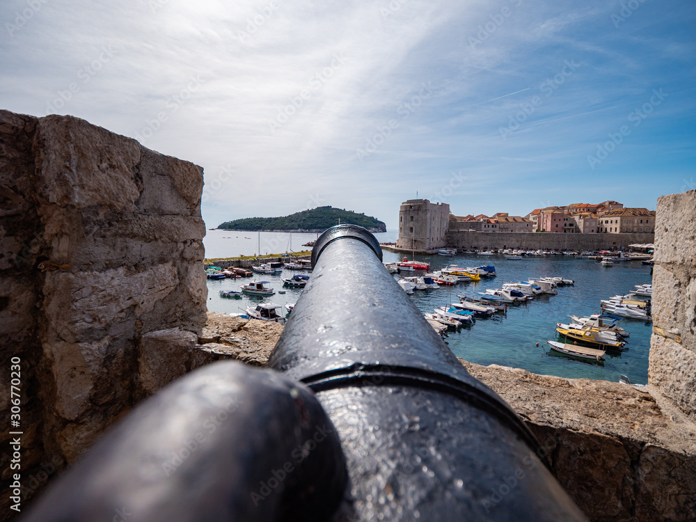 Old Cannon pointed out over Dubrovnik Old Port, Croatia