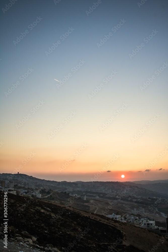 Sunset and hide behind mounts 