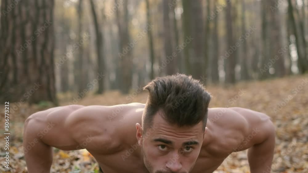 Athlete Is Pressed From The Ground In The Forest. Athlete Is Pressed From The Ground In The Forest.