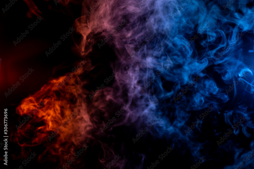 Whispy red purple and blue smoke in shape of a bear head on black background