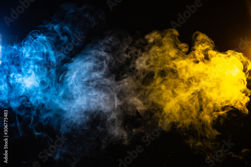 abstract blue and yellow smoke background with space for text
