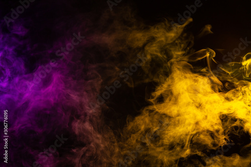 whispy purple and yellow smoke on black background with room for text