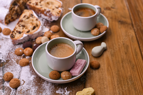 A traditional Dutch holiday for children of Sinterklaas. Winter holidays in Europe and the Netherlands. Background with pepernoten and traditional sweets. A form for writing text and aromatic coffee.