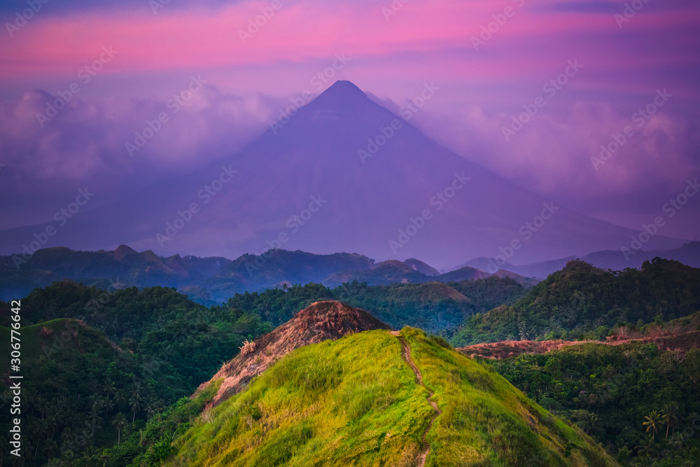 Sunset Mayon Volcano on Luzon Island Philippines. Wild Jungle Trees and Bushes, Mountain Peak and Cloudy Sky. Panoramic Photography on Amazing Exotic National Landscape View from Climb