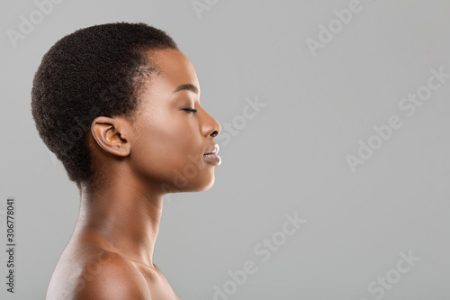 Photography Profile portrait of black woman with perfect skin and closed eyes