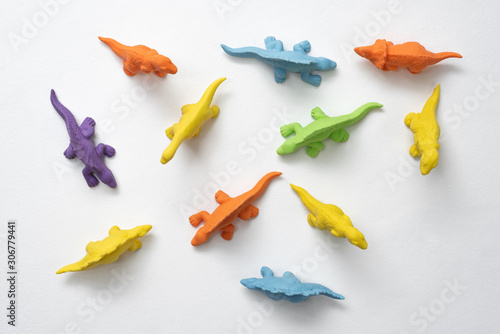 colorful children's toys dinosaurs made of thermoplastic elastomer on a white background