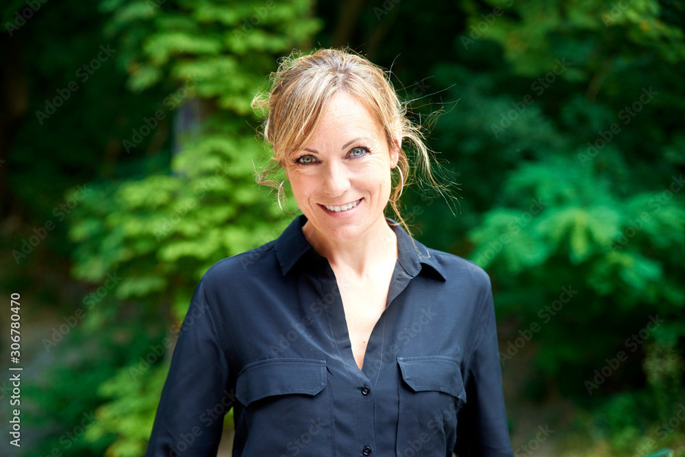 Confident middle aged woman outdoor portrait