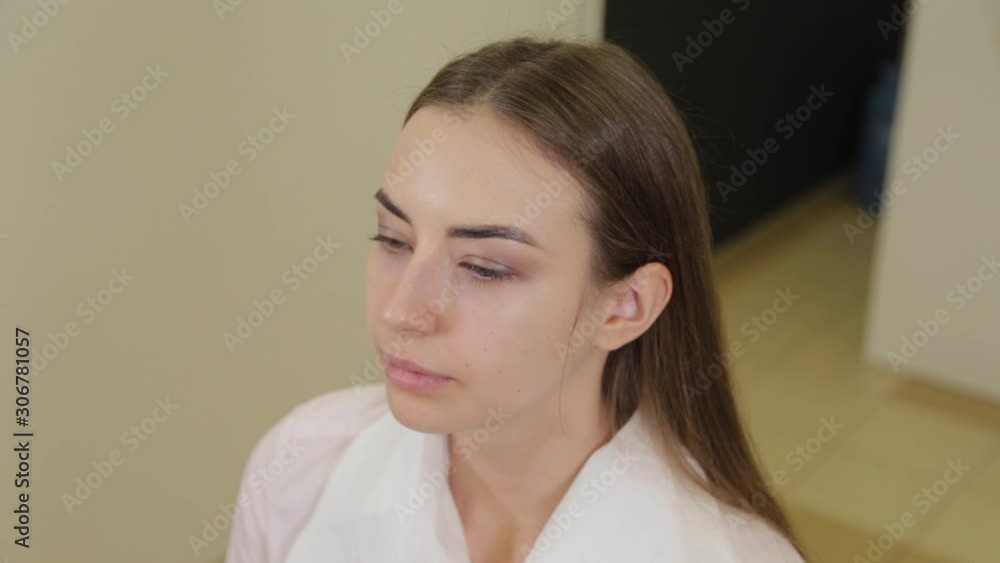 Beautiful girl in a beauty salon awaits procedure. Beautiful girl in a beauty salon awaits procedure.