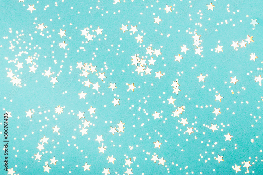 Trendy mint background with golden stars. The concept of celebrations, the Day of St. Valentine, Christmas, New Year, holiday, birthday, etc. Trendy mint background with golden stars. The concept of celebrations, the Day of St. Valentine, Christmas, New Year, holiday, birthday, etc.
