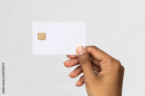 Studio shot of ethnic hand holding a credit card