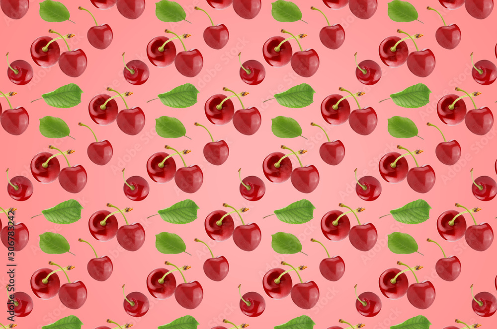 Pattern of cherry fruits with leaves on the pink surface Pattern of cherry fruits with leaves on the pink surface