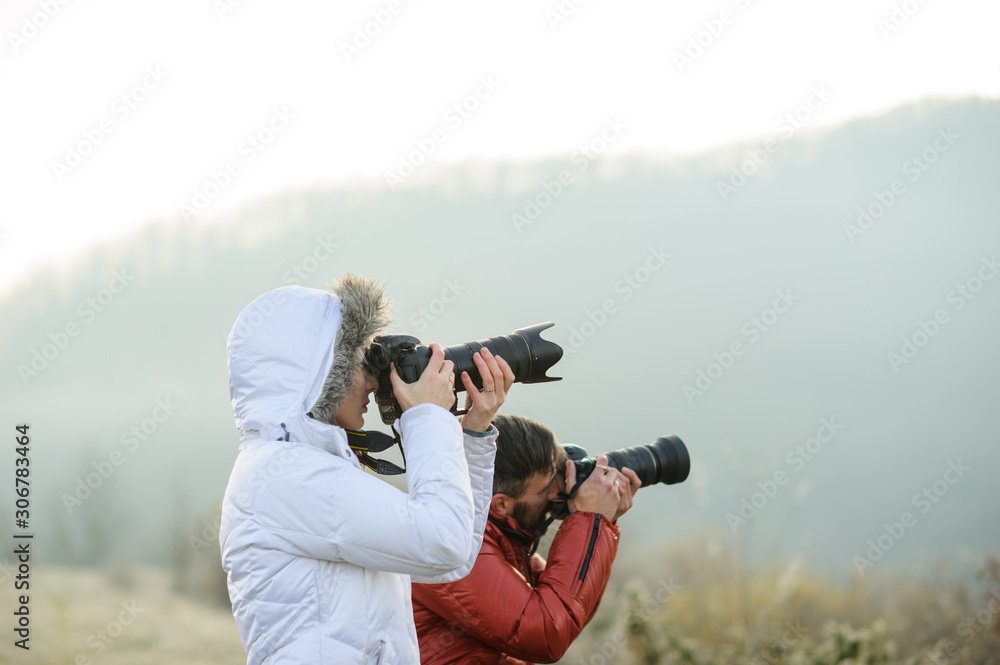 photographers with cameras outdoor making landscape pictures photographers with cameras outdoor making landscape pictures