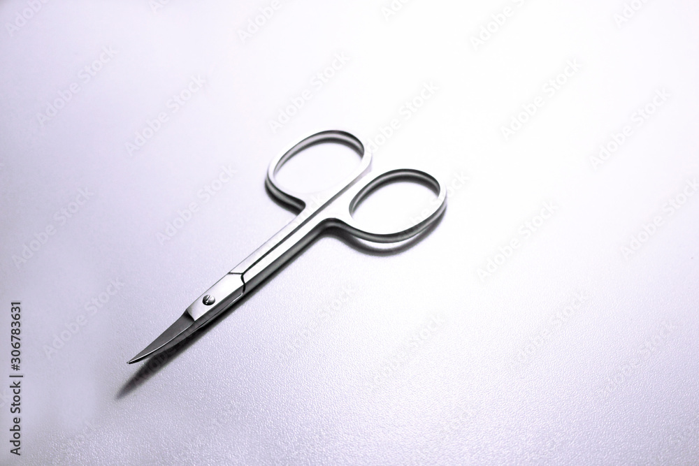 silver steel nail scissors. scissors on a neutral background silver steel nail scissors. scissors on a neutral background