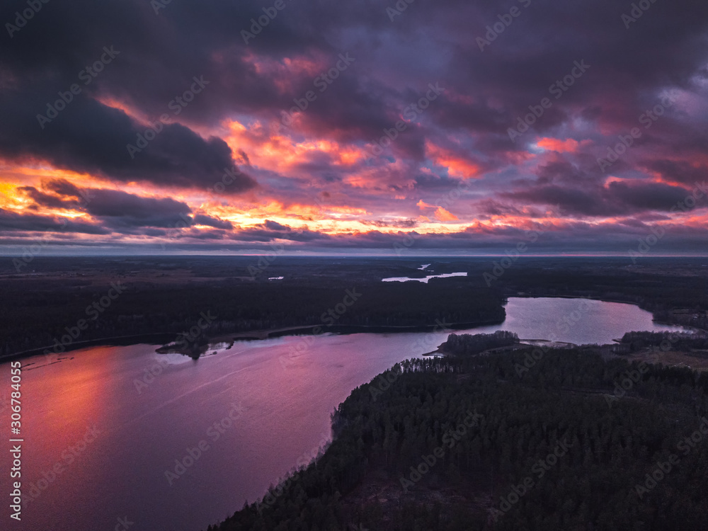 Fototapeta premium Lake with islands and a purple sunset, aerial panorama