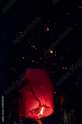 Launched swarms of sky floating lanterns into the air.
