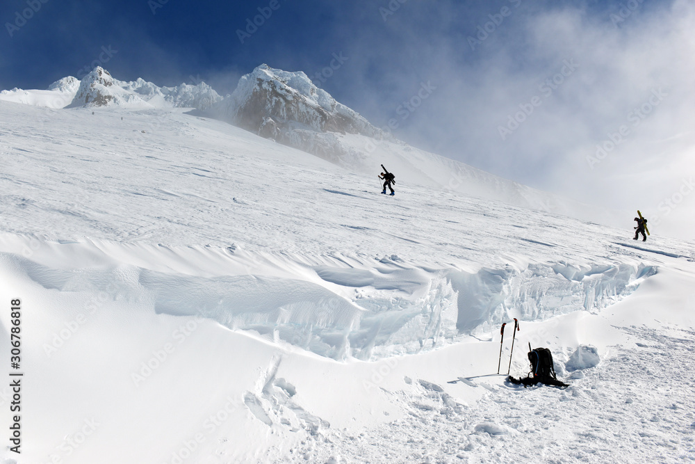 Unidentifiable climbers on snow covered Mount Hood in early Spring Unidentifiable climbers on snow covered Mount Hood in early Spring