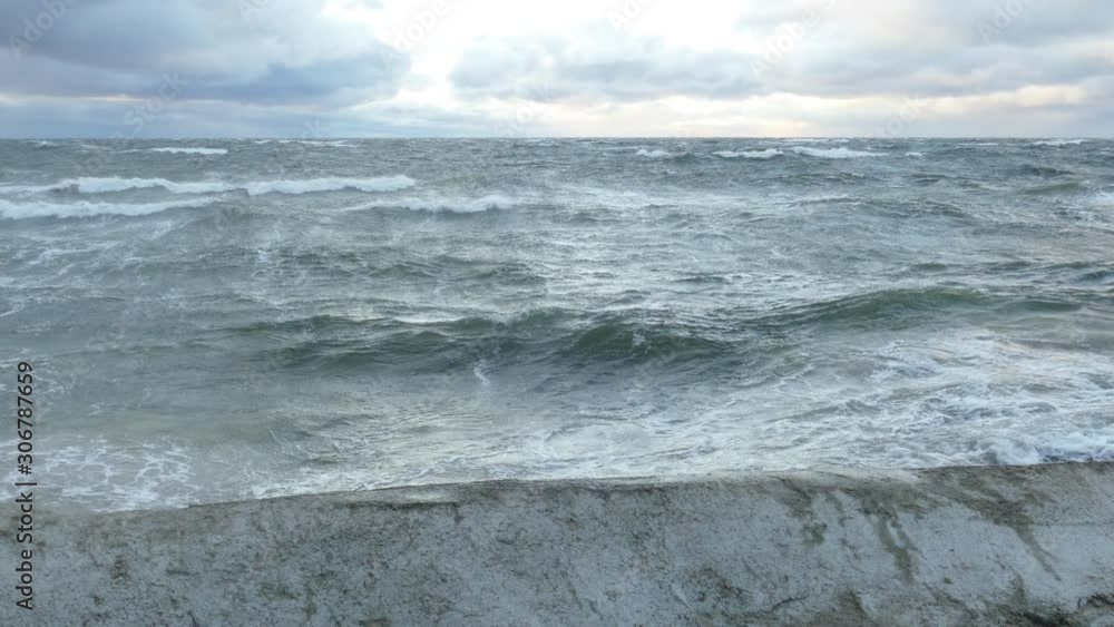 Large Sea waves Crashing against shore during heavy storm Large Sea waves Crashing against shore during heavy storm