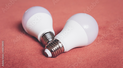 Light bulbs on a soft fluffy peach-colored background