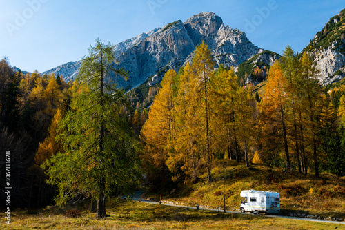 Driving caravan on a mountain road in Slovenia in fall