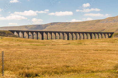 Viaduct with many arches in beautiful countryside.