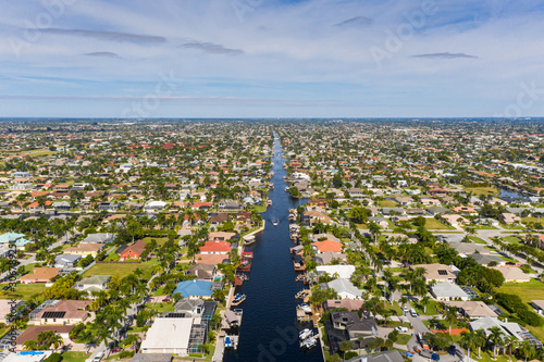 Aerial photos of Cape Coral residence houses and canals with Fort Myers in the background