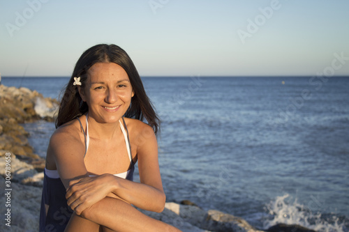 Portrait of smiling young girl with beach background