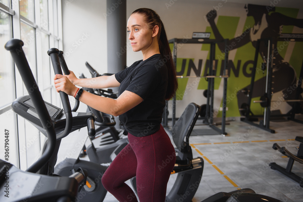 Woman was running on the treadmill in the gym Woman was running on the treadmill in the gym