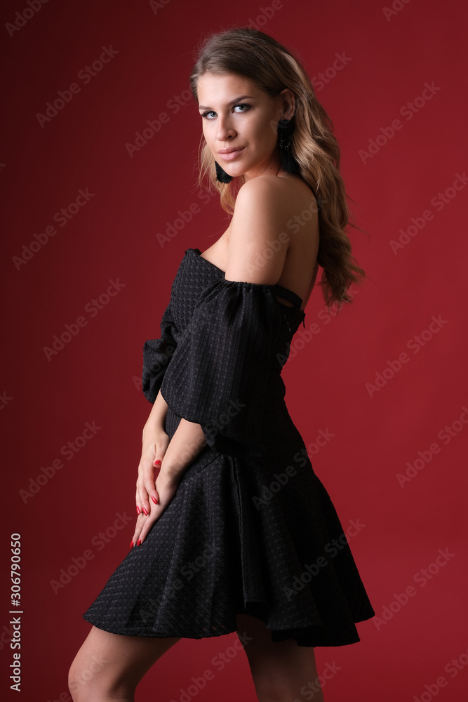 Beautiful glamour blonde model in black dress looks stunning. Beautiful glamour blonde model in black dress looks stunning.