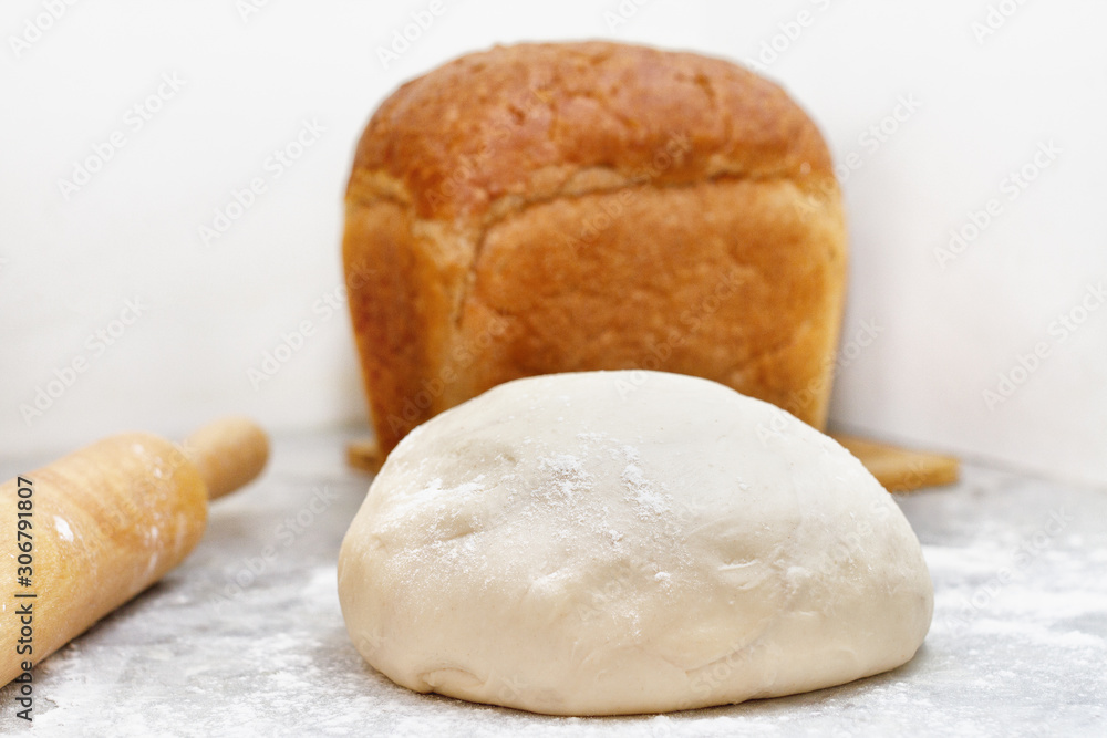one bun of baked brown bread stand on the table one bun of baked brown bread stand on the table