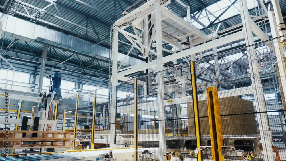 machine takes stone thermal insulation from pile in shop machine takes stone thermal insulation from pile in shop