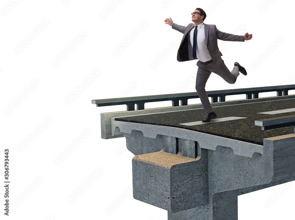 Young businessman with broken bridge isolated on white Young businessman with broken bridge isolated on white