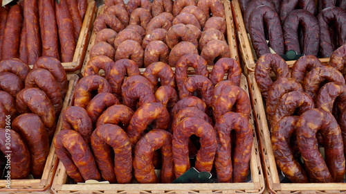 Various types of chorizo ​​from Spain and Portugal at a farmbacon, meat, sausage, chorizo, bacon, air-dried, black pudding, fatty, smoked, smoked, smoked, raw sausage, specialtyers market in Portugal.