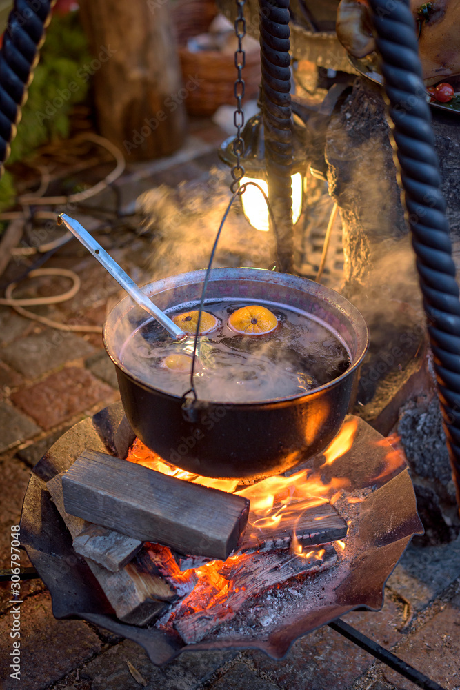 Kettle with hot wine on the fire