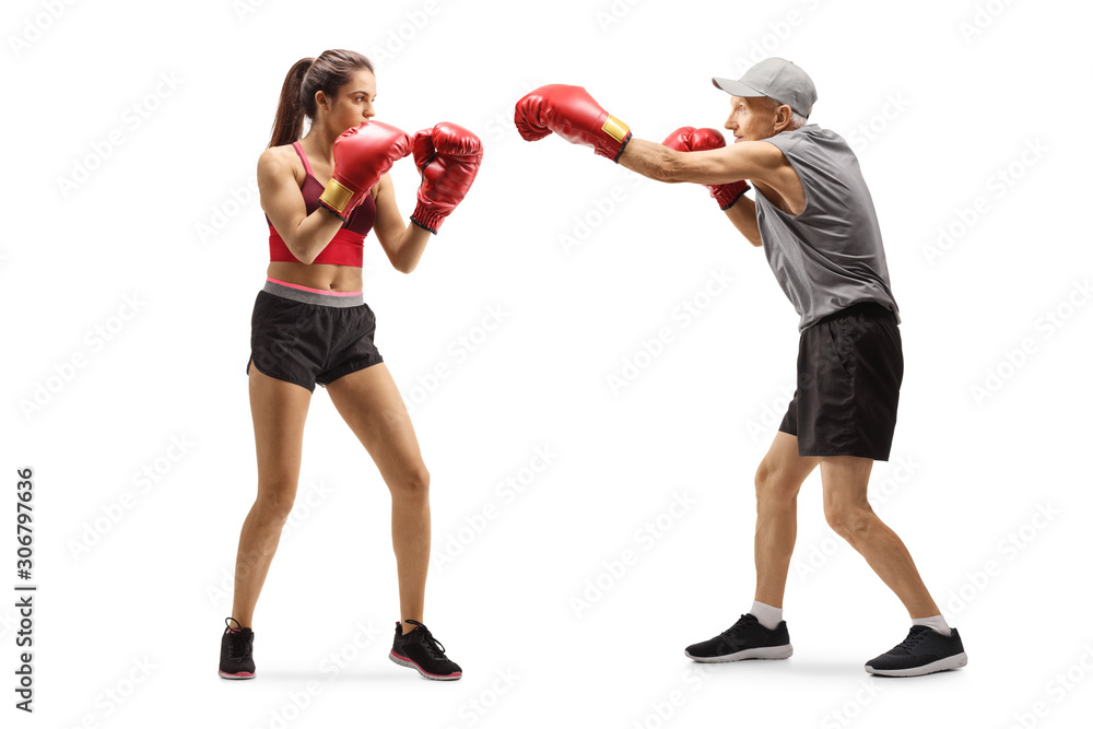 Senior man and a young woman training box Senior man and a young woman training box