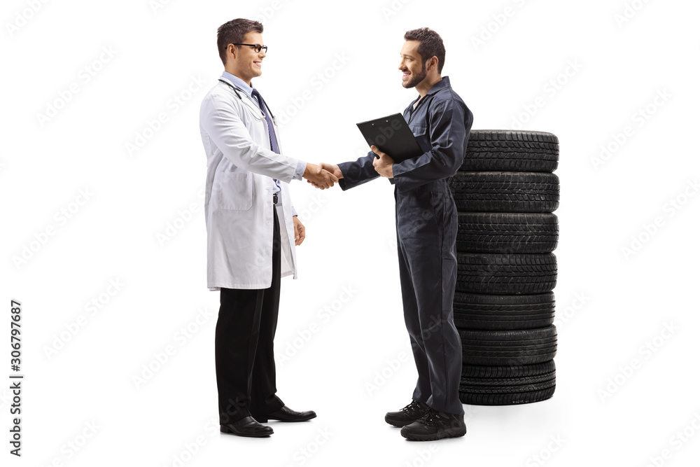 Auto mechanic and a doctor shaking hands Auto mechanic and a doctor shaking hands