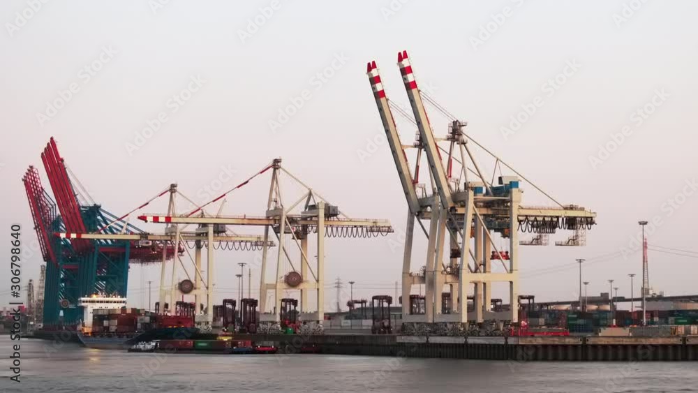 From day to night timelapse video of work on unloading containers in a cargo seaport ,Hamburg, Germany From day to night timelapse video of work on unloading containers in a cargo seaport ,Hamburg, Germany
