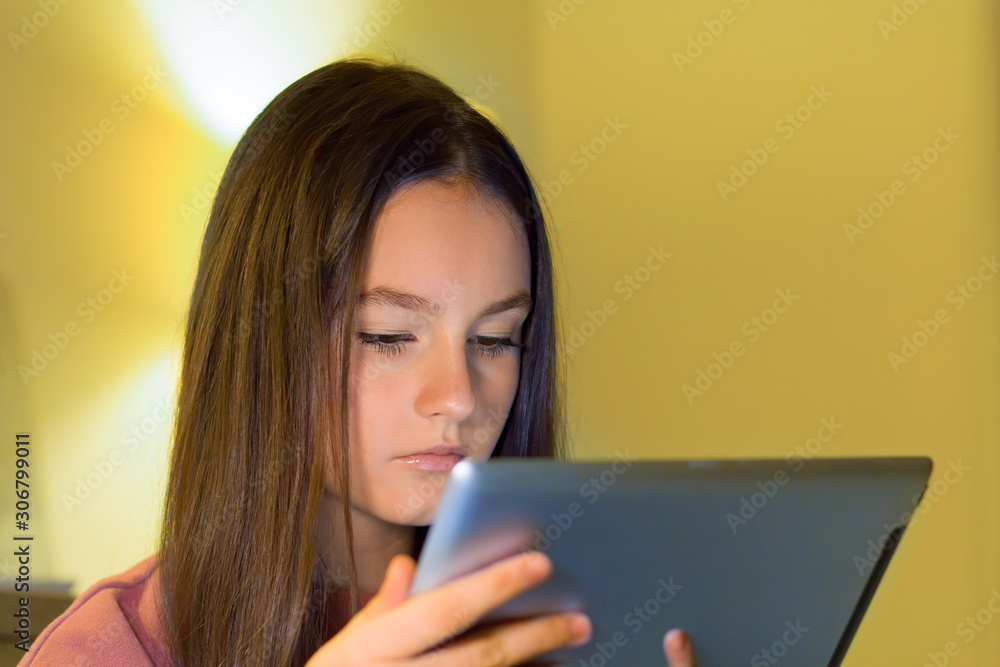 Teenage girl with tablet surfing on social, watch video, tutorials. games, yuotuber Teenage girl with tablet surfing on social, watch video, tutorials. games, yuotuber